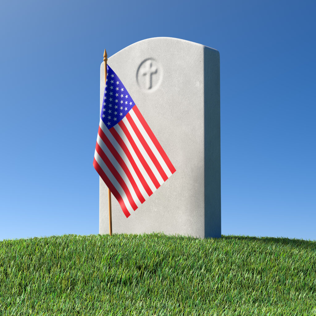 A grave with an american flag on top of it.