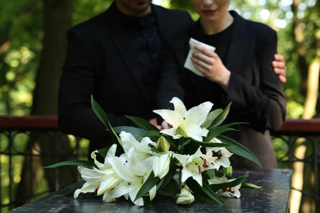 White lilies on a marble surface.